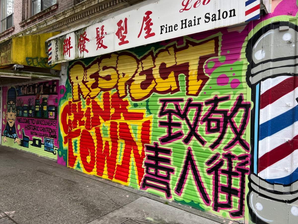A mural Smokey D and Trey Helten created for the barber shop next to Tommy Wong's store. 