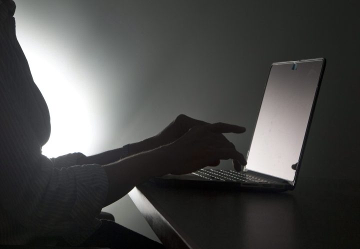 In this, Monday, Dec. 12, 2016, file photo illustration, a person types on a laptop, in Miami.