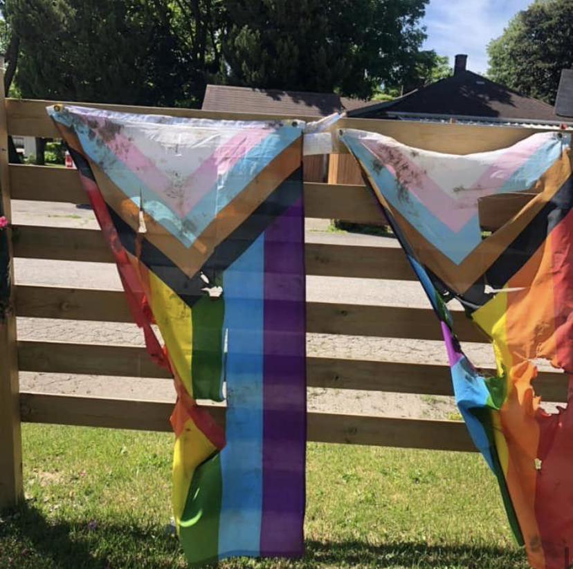 Pride flags outside Indigo Lounge and Wellness Centre in Tillsonburg, Ont., were burned, slashed and discoloured in the early hours of Tuesday, June 14, 2022. A threatening and homophobic message directed towards the owner was also left on the property.