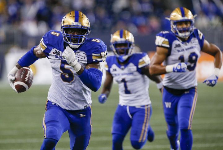 Winnipeg Blue Bombers’ Willie Jefferson (5) runs in his interception for the touchdown against the Hamilton Tiger-Cats during the second half of CFL action in Winnipeg, Friday, June 24, 2022.