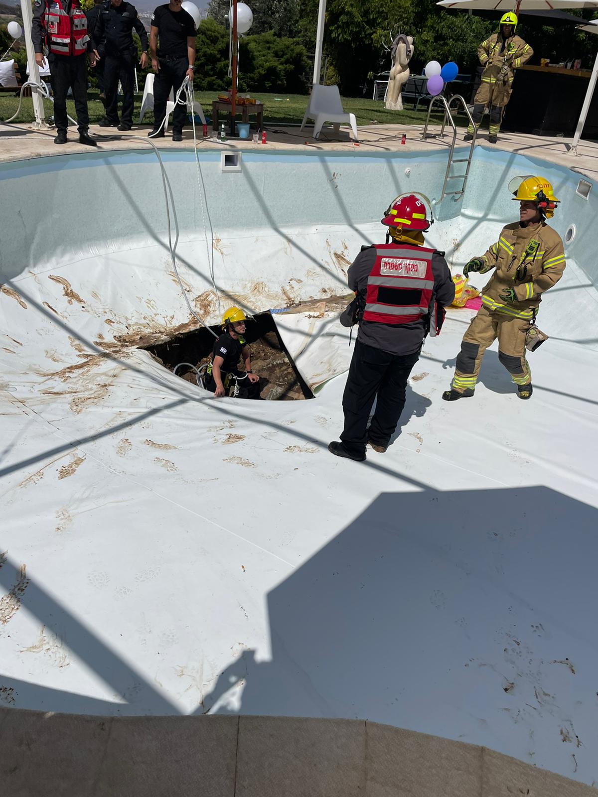 The sinkhole that opened underneath an in-ground pool in Israel on Thursday.
