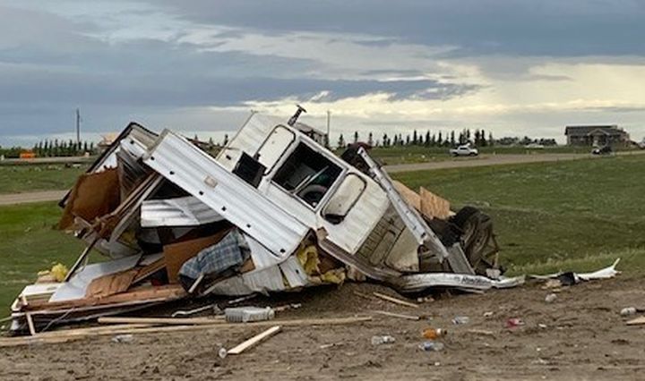 A trailer, vehicles and a home under construction were all damaged on the same property just outside Medicine Hat, Alta., on July 18, 2022 after a powerful storm tore through the area.