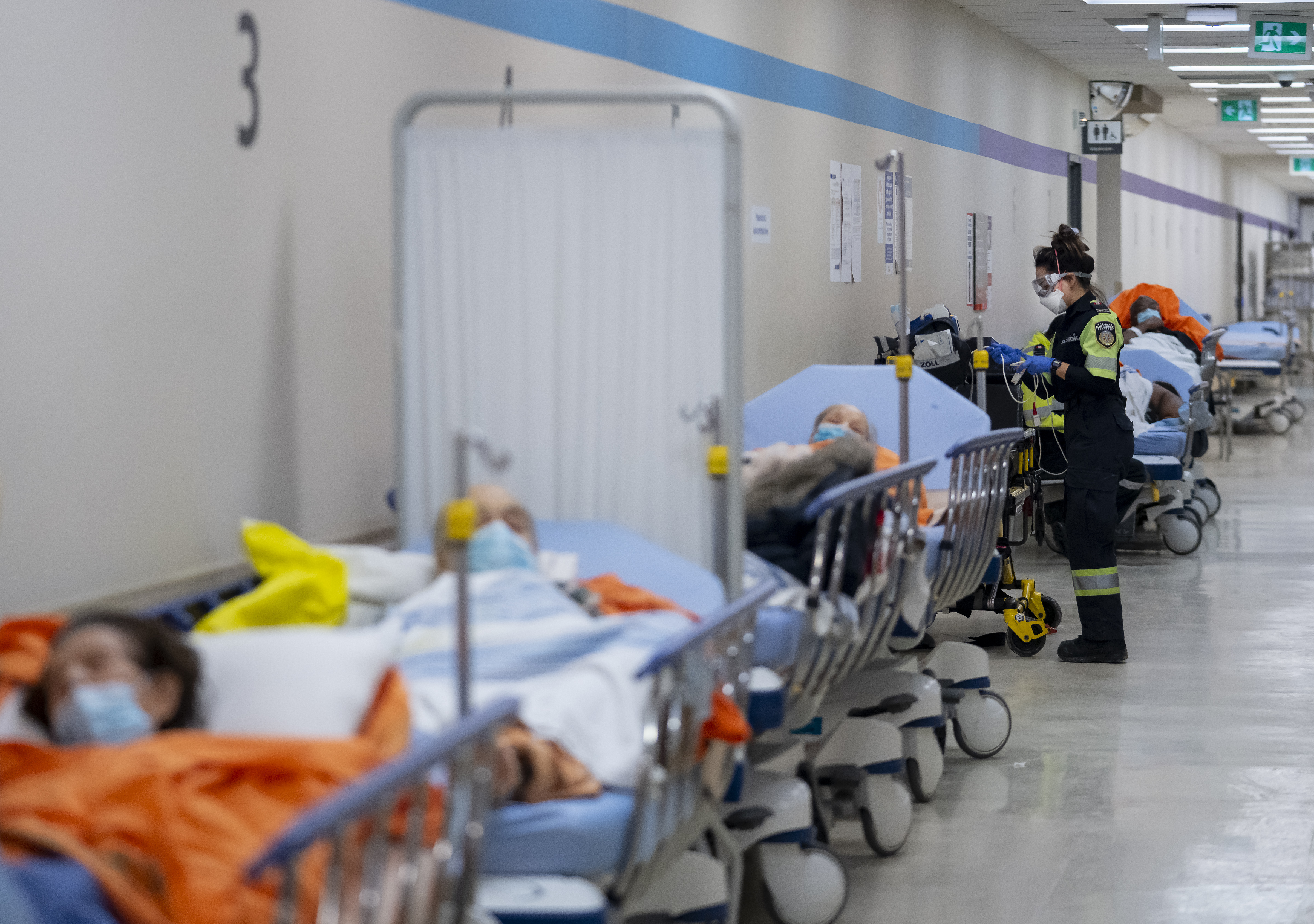 Patients in the emergency department of Humber River Hospital in Ontario line the hallways, due to overcapacity in the ER.