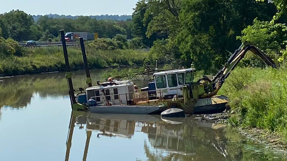 A dredging boat in Chedoke Creek near Kay Drage Park Hamilton.