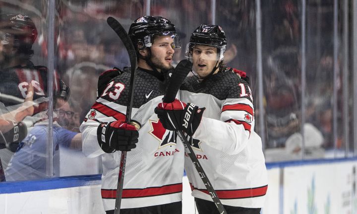 Canada’s Mason McTavish (23) and Brennan Othmann (15) celebrate a goal against Slovakia during second period IIHF World Junior Hockey Championship action in Edmonton on Thursday August 11, 2022.