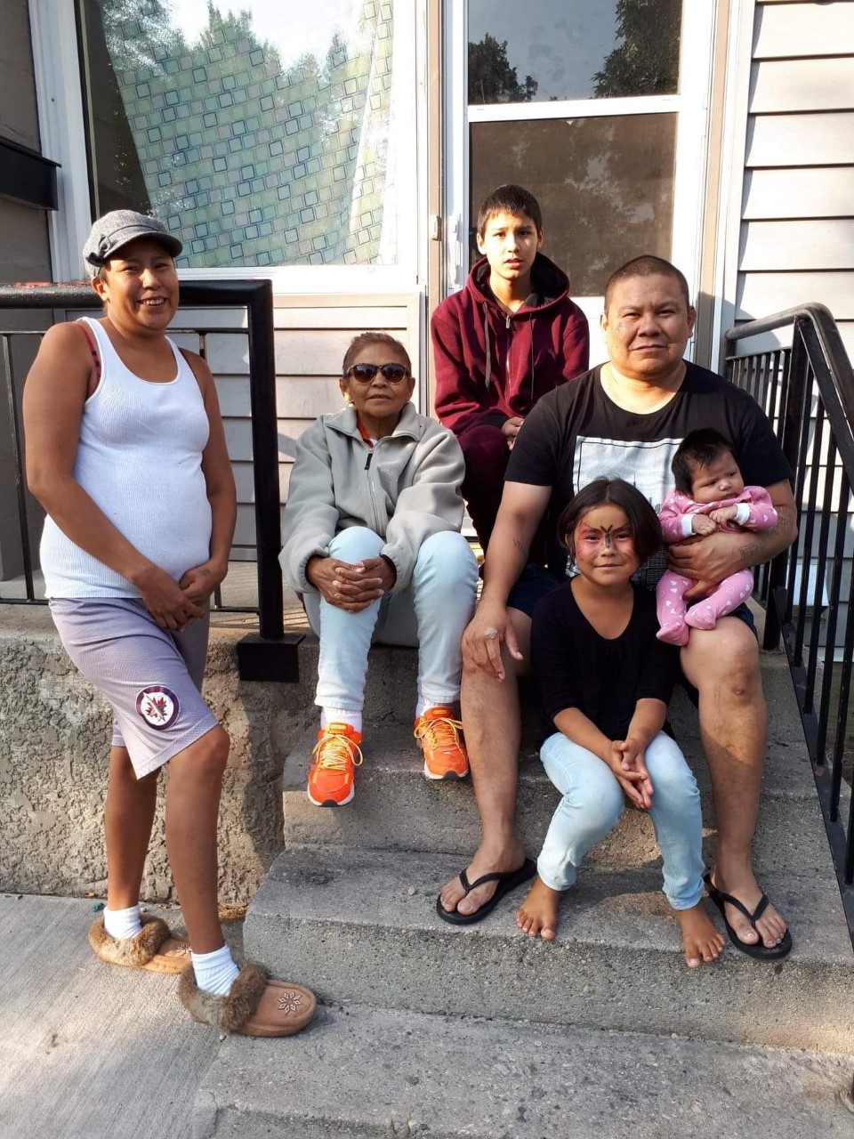 Chris Amyotte with his partner Amanda, his mother, and three of his children.