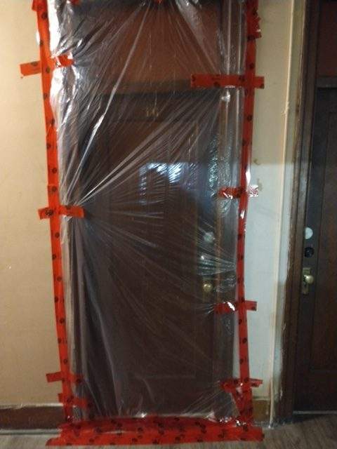 The door of unit 16, where Van Chung Pham lived, in the weeks after his body—and the decomposing remains of two others—were discovered.