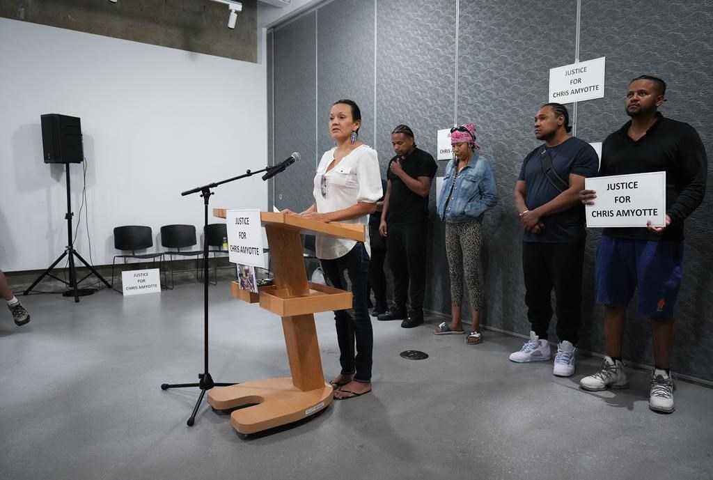 Chris Amyotte's cousin, Samantha Wilson, delivers a statement in front of (from left) Amyotte's brother Isaac Ndlovu, wife Amanda Cook, and brothers Michael Ndlovu and Richard Ndlovu during a news conference in Vancouver, B.C., Thursday, Sept. 1, 2022. Amyotte, an Ojibway man from Manitoba, died after he was shot by Vancouver police with a beanbag gun in the Downtown Eastside last month. 