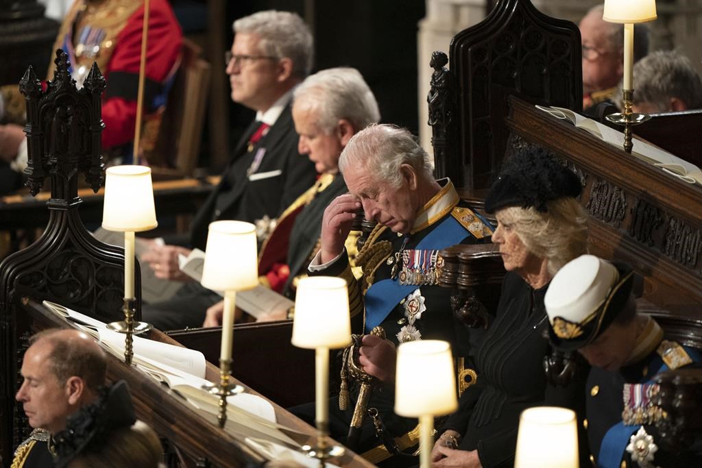 King Charles III, center, attend the committal service for Britain’s Queen Elizabeth II at St George’s Chapel, Windsor Castle, in Windsor, England, Monday, Sept. 19, 2022.