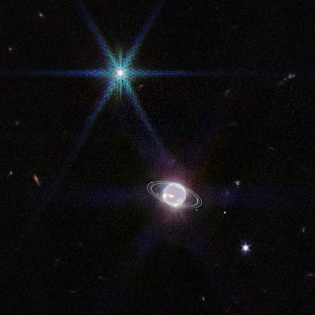 This image provided by NASA on Wednesday, Sept. 21, 2022, shows the Neptune system captured by Webb's Near-Infrared Camera.