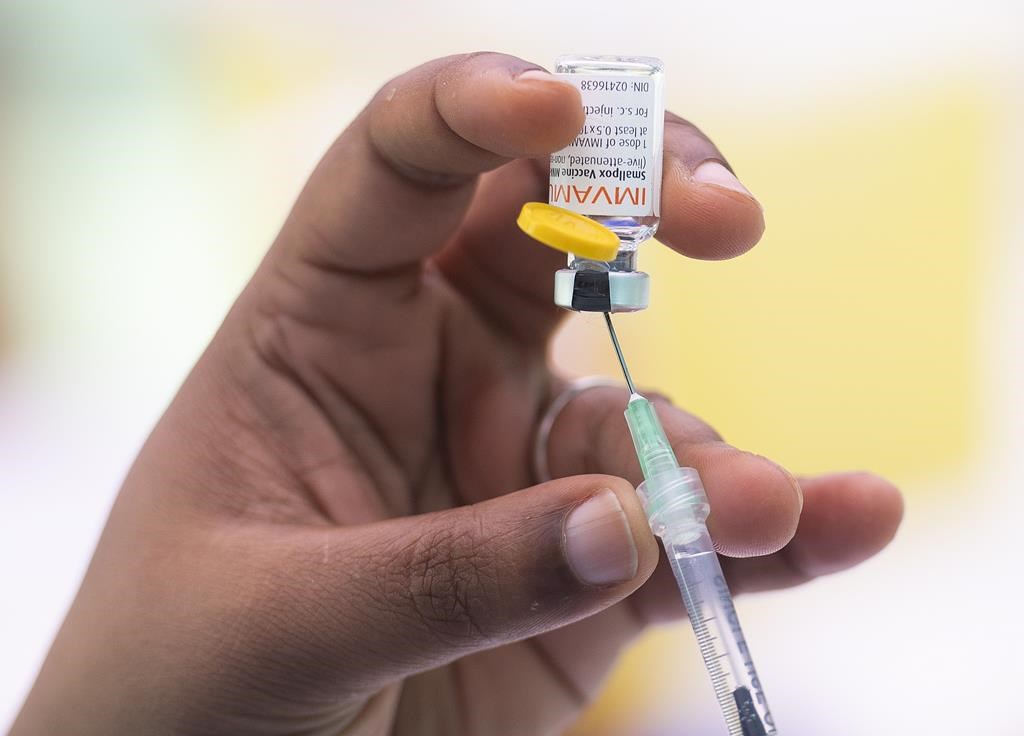 A health-care worker prepares monkeypox vaccine in Montreal on July 23, 2022. Second doses of the monkeypox vaccine will be available to British Columbians starting this week. THE CANADIAN PRESS/Graham Hughes.