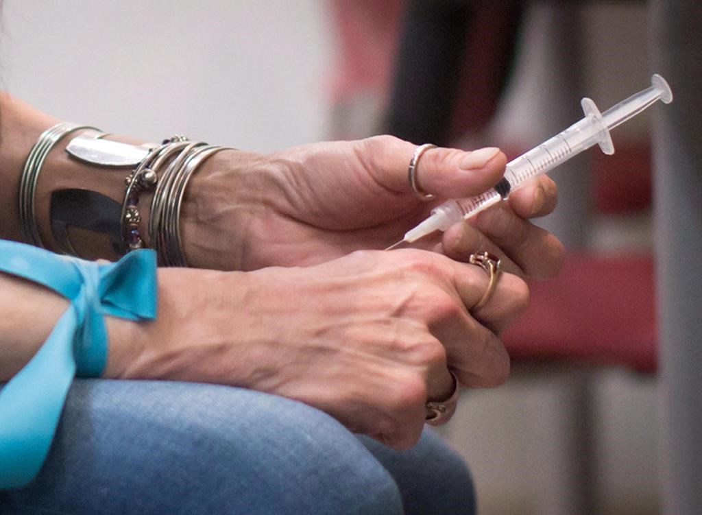 A person injects hydromorphone.