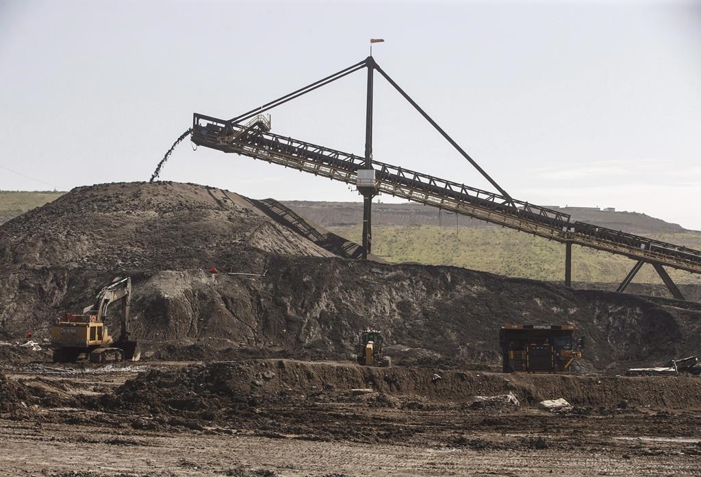 A file photo of a hopper moving dirt in Suncor's Millennium mine in the oilsands in Fort McMurray Alta, on Monday June 13, 2017.