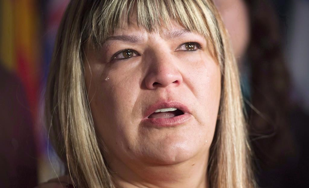 A tear rolls down the cheek of Bernadette Smith, from Winnipeg, as she talks about the Missing and Murdered Indigenous Women inquiry in this file photo.