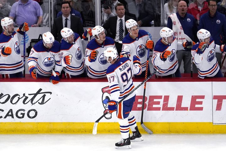 Edmonton Oilers centre Connor McDavid (97) celebrates with teammates after scoring a goal during the third period of an NHL hockey game against the Chicago Blackhawks in Chicago, Thursday, Oct. 27, 2022.