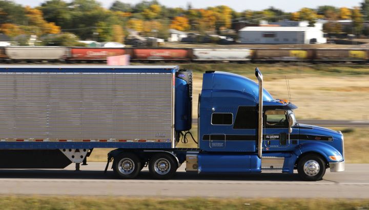 A tractor-trailer transport truck hauls cargo on the Trans-Canada Highway (TCH) near Gull Lake, Sask. on Fri., Sept. 9, 2018. 