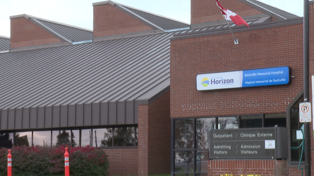 A Canadian flag waves at the entrance of Sackville Memorial Hospital