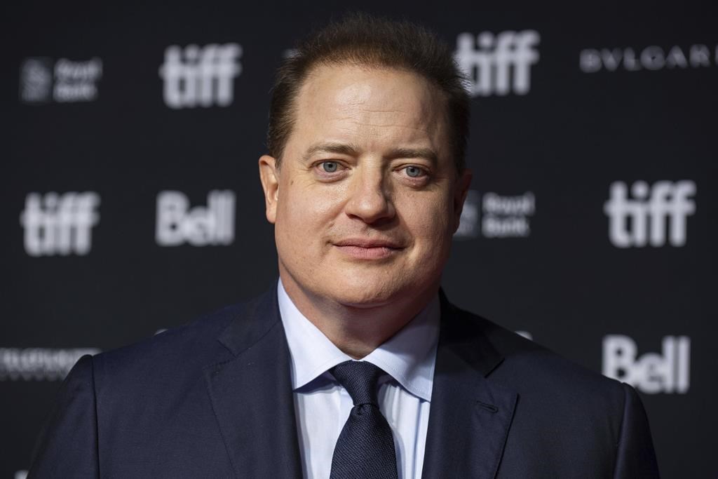 Brendan Fraser in a black suit.