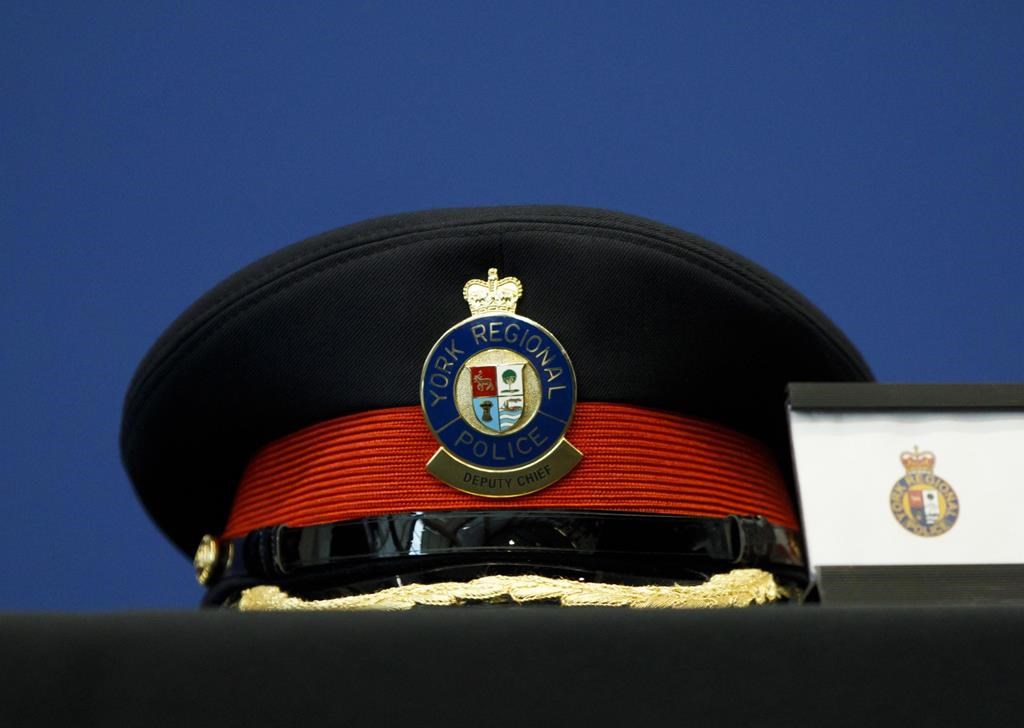 A York Regional Police deputy chief's hat is seen on a table during a press conference at the headquarters in Aurora, Ont., on March 11, 2019.