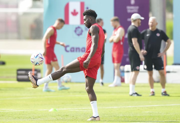 Canada defender Alphonso Davies kicks the ball during practice ahead of the World Cup in Doha, Qatar on Saturday, November 19, 2022.