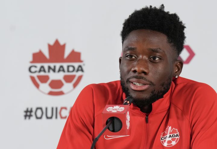 Canada forward Alphonso Davies speaks to the media after practice at the World Cup in Doha, Qatar on Tuesday, November 29, 2022.