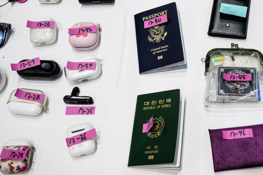 Personal belongings, including a US (top) and South Korean passport retrieved by police.