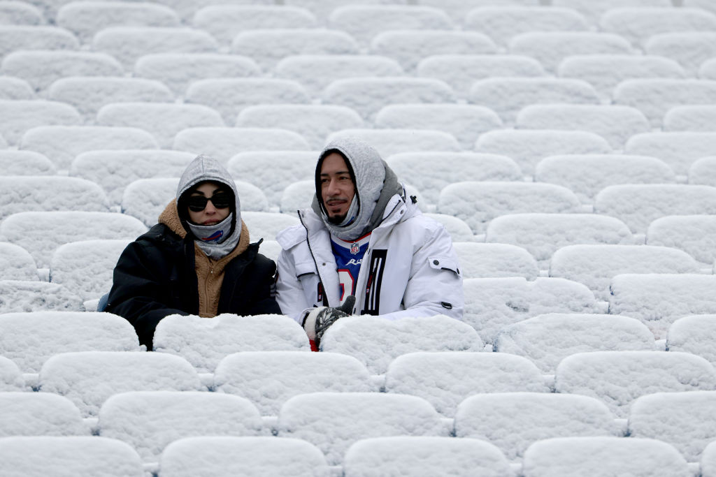 FILE - Buffalo Bills fans look on from snow covered seat prior to the game against the Atlanta Falcons at Highmark Stadium on January 02, 2022 in Orchard Park, New York.