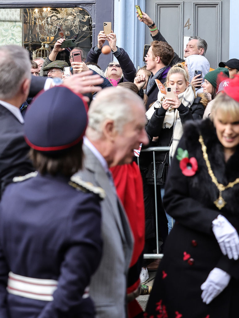 An egg is thrown by a member of the public, seen just above King Charles III’s head, as he and Camilla, Queen Consort arrive for the Welcoming Ceremony to the City of York at Micklegate Bar during an official visit to Yorkshire on Nov. 09, 2022 in York, England.