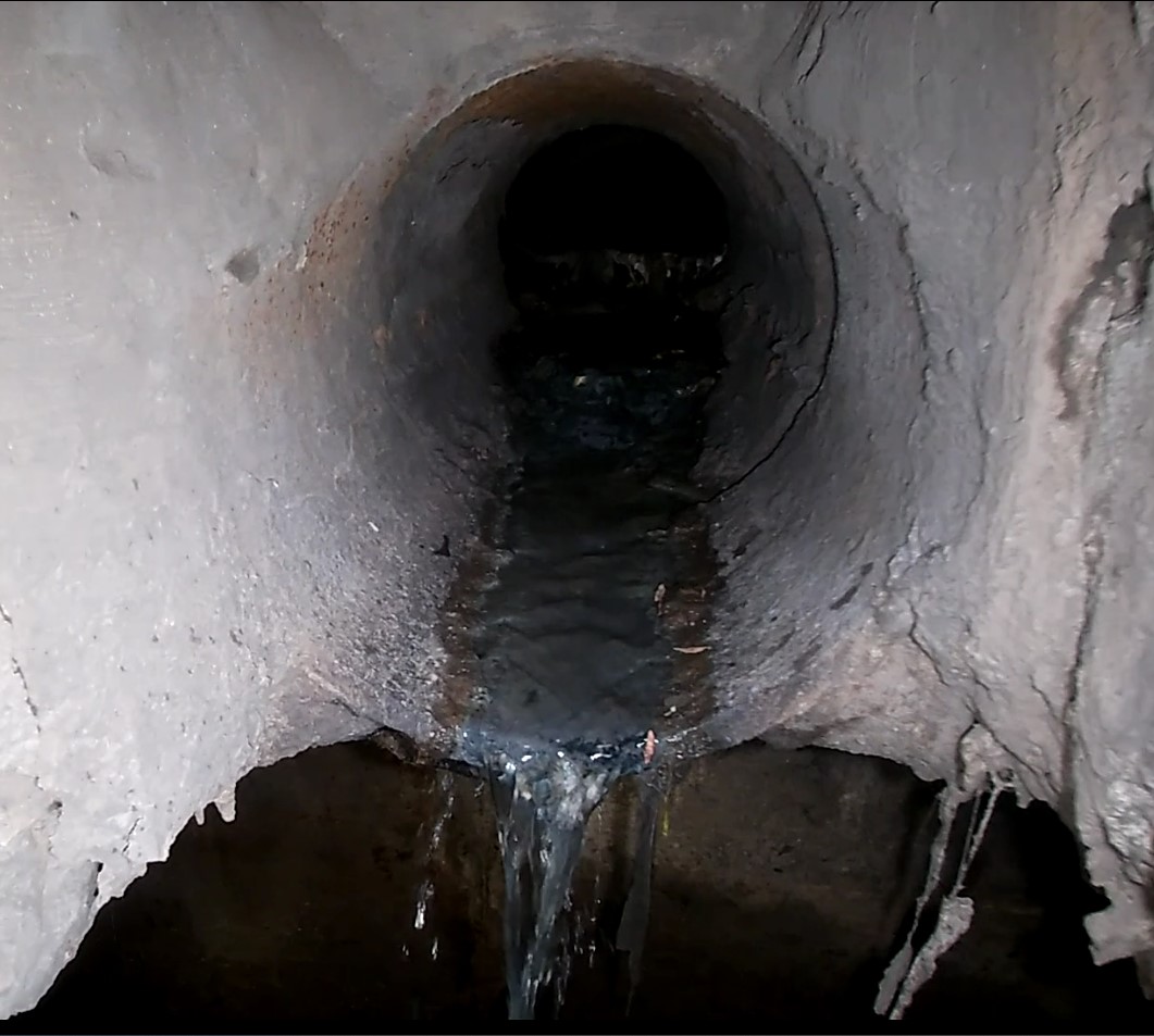 Photo taken by Hamilton Water November 22, 2022 of the combined sewer with noticeable flow dropping out and into the storm sewer.
