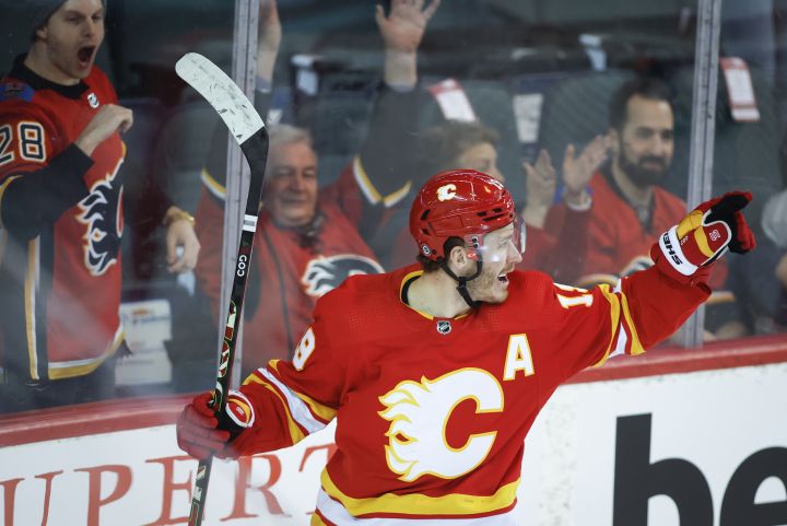 Calgary Flames’ Matthew Tkachuk celebrates his goal during first period NHL hockey action against the Seattle Kraken in Calgary, Saturday, Feb. 19, 2022.