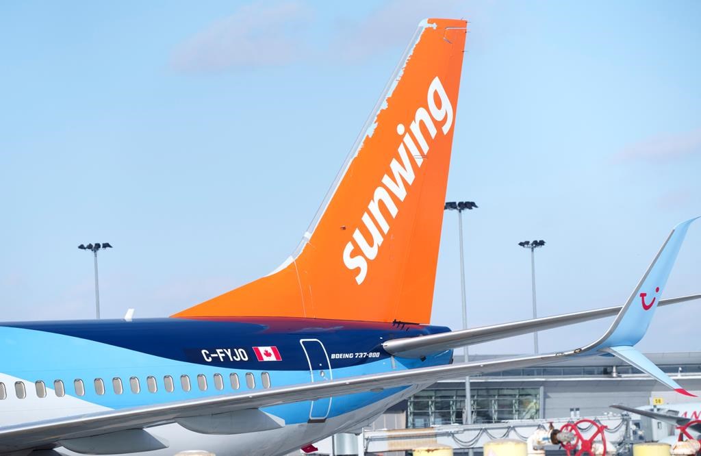 A Sunwing aircraft is parked at Montreal Trudeau airport in Montreal on March 2, 2022.