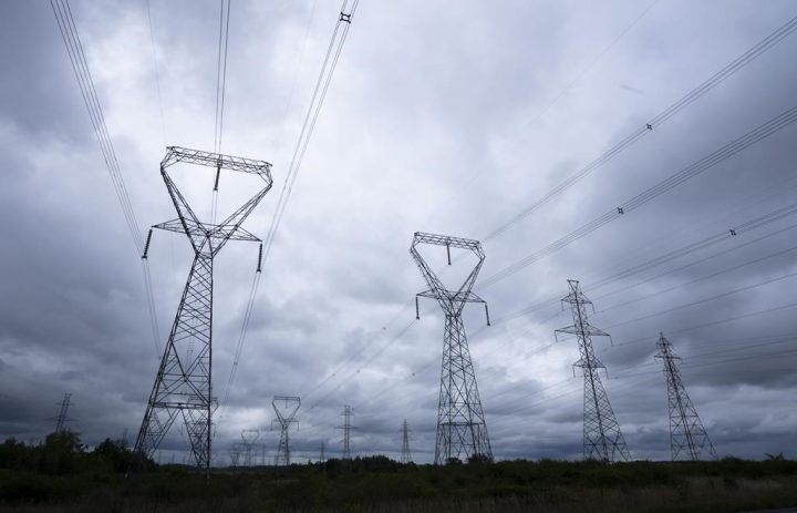 Power lines are seen against cloudy skies near Kingston, Ont., Wednesday, Sept. 7, 2022. 