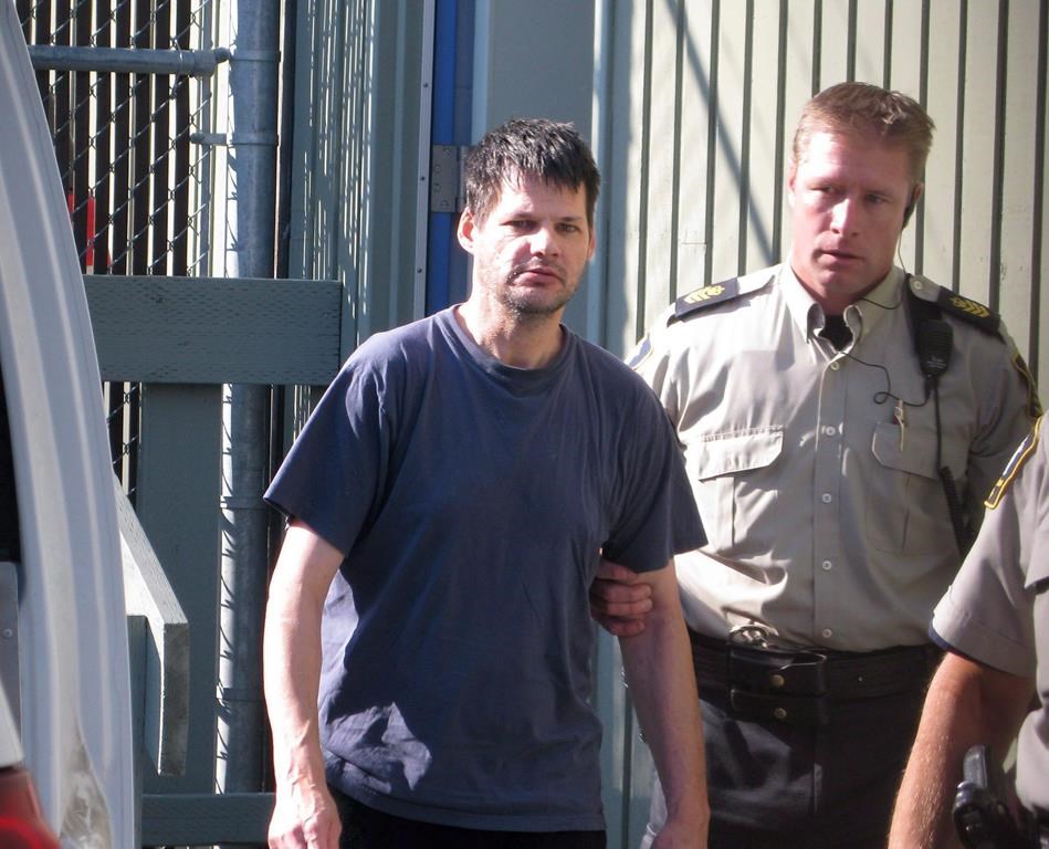 Randall Hopley is led out of the Cranbrook, B.C. courthouse on Sept. 14, 2011. More than four years after the convicted sex offender finished his sentence for abducting a young British Columbia boy, the parole board is recommending charges against Hopley for not complying with his supervision orders. THE CANADIAN PRESS/Bill Graveland.