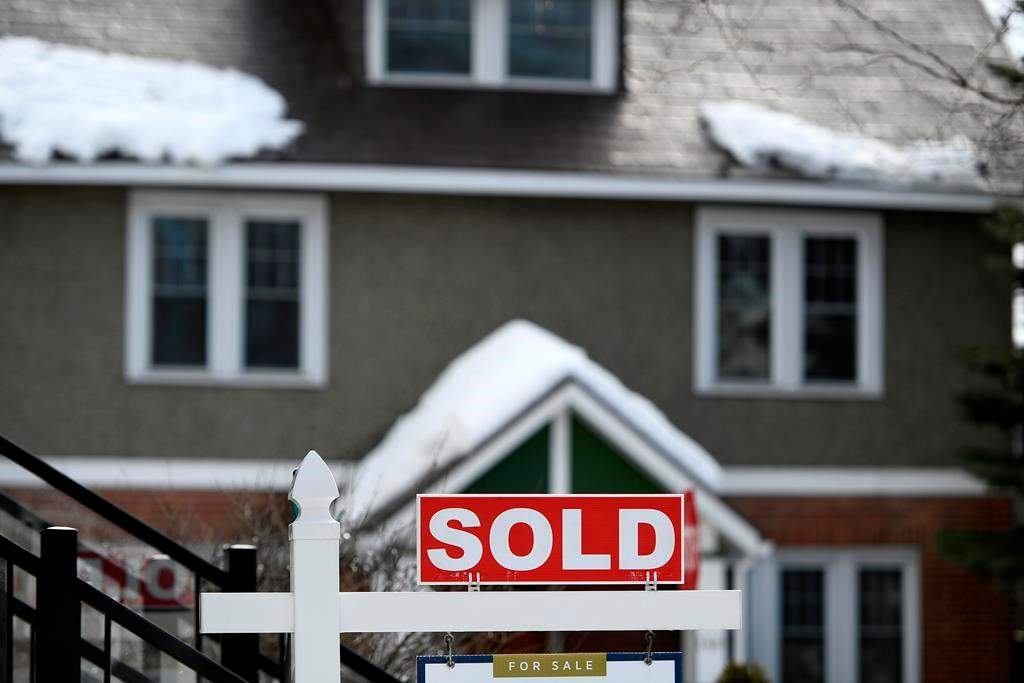 A for sale sign outside a home indicates that it has been sold, in Ottawa, on Monday, March 1, 2021. Canada's banking regulator is launching public consultations on rules around mortgage lending as it says loan risks have increased considerably since the start of the COVID-19 pandemic. THE CANADIAN PRESS/Justin Tang
.