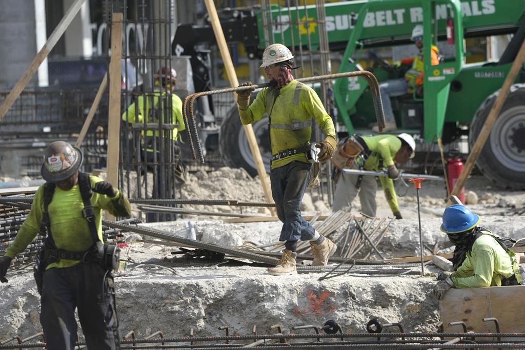 People work at a construction site. AP Photo/Lynne Sladky.