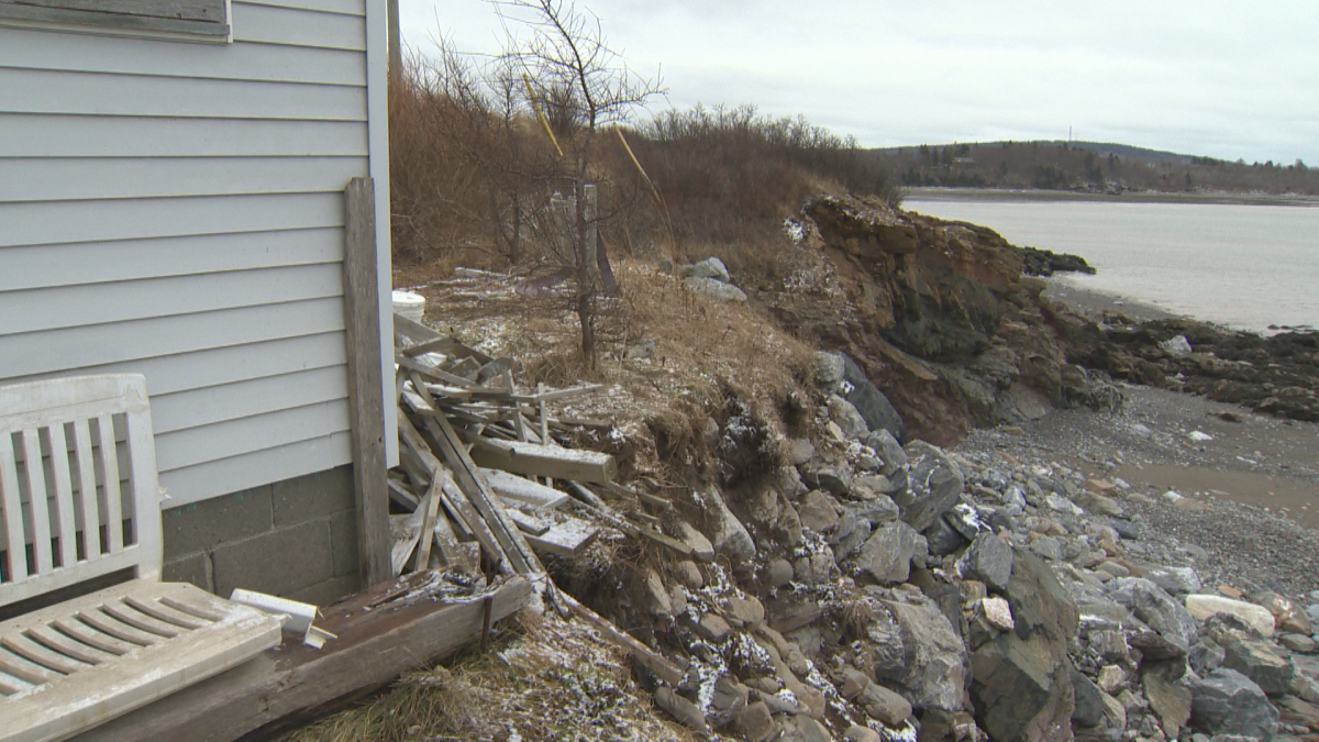 A winter storm wiped out much of Dana Bagley’s fence, leaving his shed on the edge of a cliff.