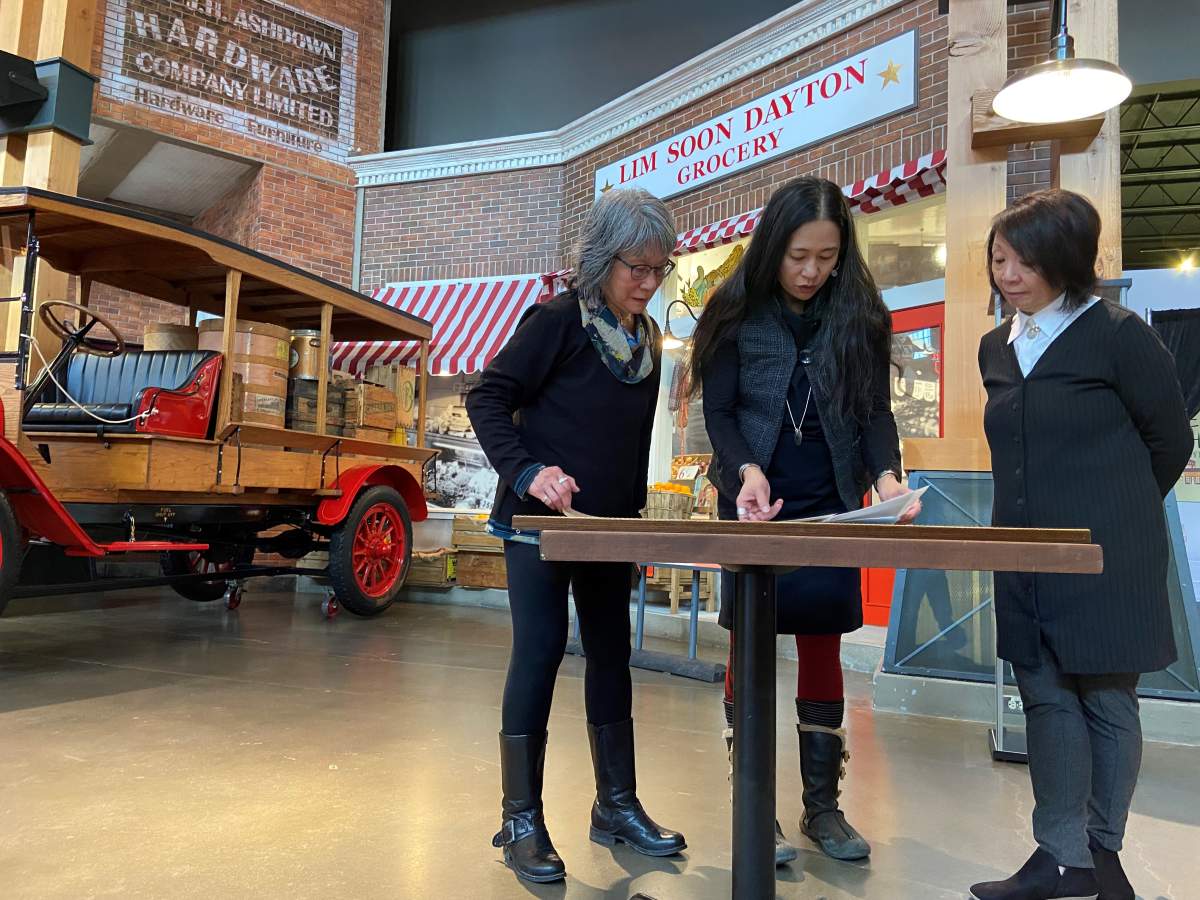 Family of Lim Soon Dayton outside renamed grocery store exhibit.