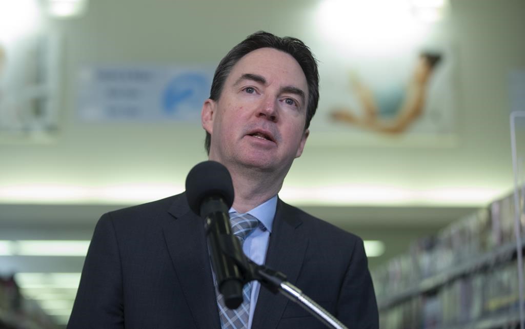 Alberta Health Minister Jason Copping makes an address in Edmonton, on Tuesday, Dec. 6, 2022. Copping says there will be $158 million in the upcoming budget to attract more physicians and other health-care professionals to fill gaps in care.