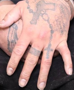 Tattoos on the hand of Edmonton homicide suspect Donn Austin Gauthier.
