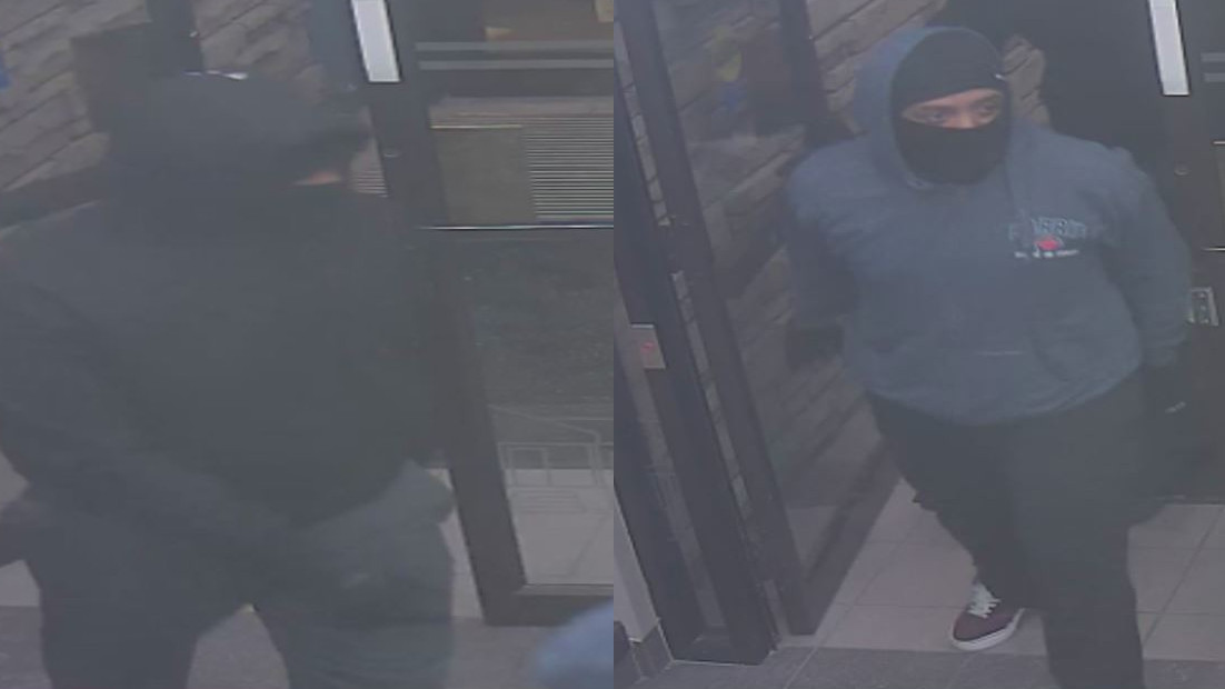 Police are seeking a pair of suspects who took money at gunpoint from the Meridian Credit Union on Portage Road in Niagara Falls, Ont.
