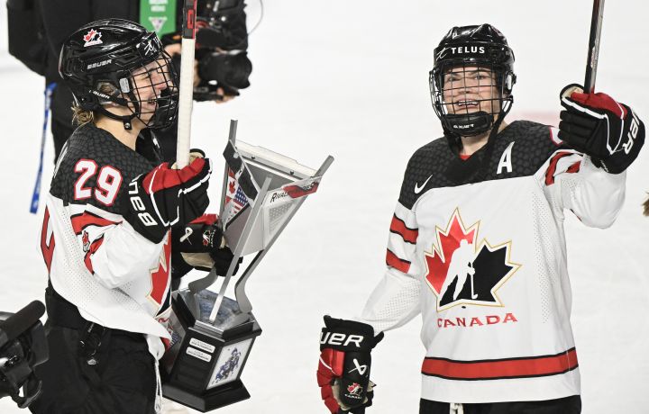 Marie-Philip Poulin (29) and Blayre Turnbull of Canada celebrate after defeating the USA in Rivalry Series hockey in Laval, Que., Wednesday, February 22, 2023.