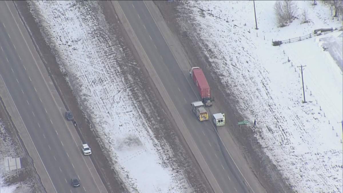 Emergency crews attend a crash near Okotoks, Alta., on Feb. 9, 2023.
