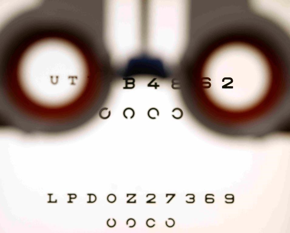 An optometrist holds glasses in front a lightbox during an eyesight test in Bremen, Germany, on Friday, Jan. 16, 2009. Ontario Health Minister Sylvia Jones is defending changes to optometry coverage that reduce the frequency of eye exams for healthy seniors, saying a new agreement strengthens care for people with eye conditions. THE CANADIAN PRESS/AP-Joerg Sarbach.