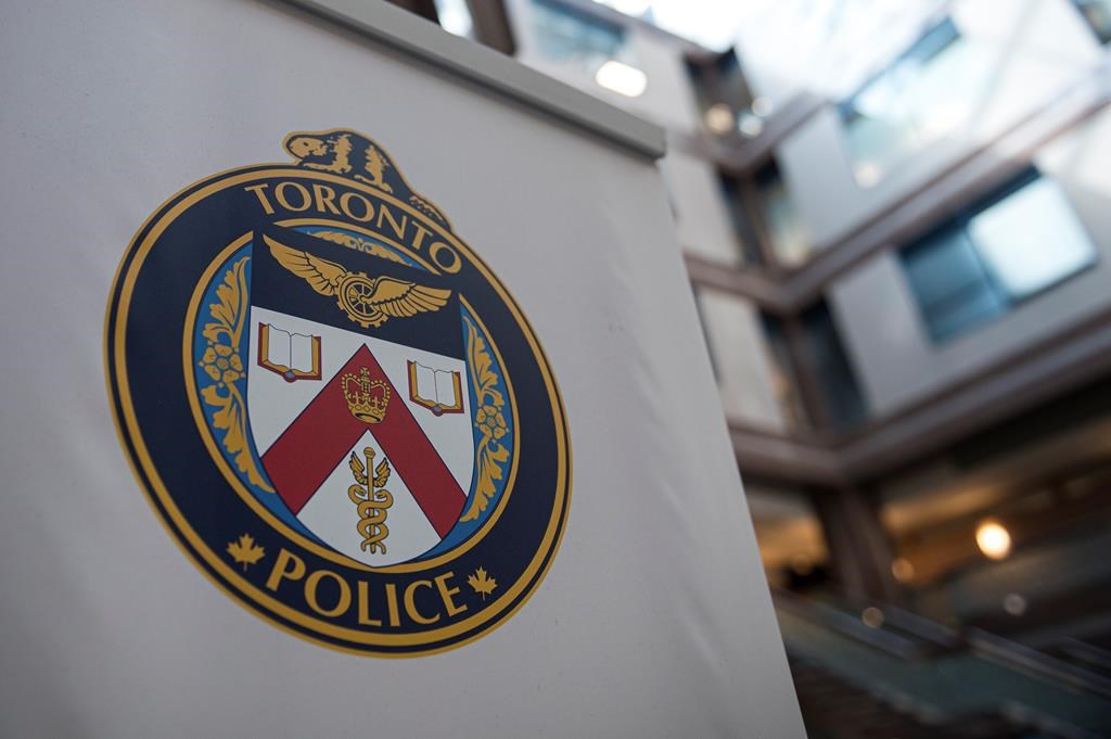 A Toronto Police Services logo is shown at headquarters, in Toronto, on Friday, August 9, 2019.Toronto police say they are investigating a possible hate crime after graffiti appeared on the walls of a mosque in the city. THE CANADIAN PRESS/Christopher Katsarov.