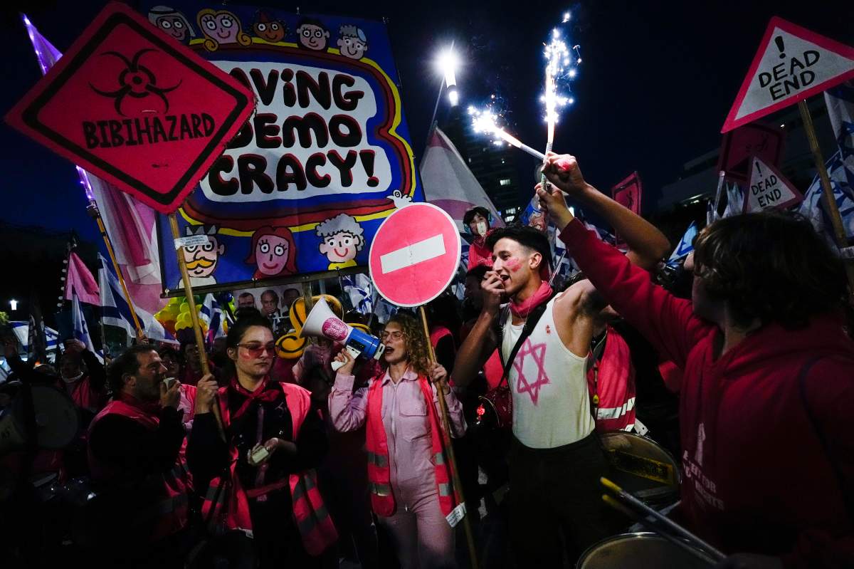 Israelis protest Saturday against plans by Prime Minister Benjamin Netanyahu’s government to overhaul the judicial system, in Tel Aviv, Israel. (AP Photo/Ohad Zwigenberg)