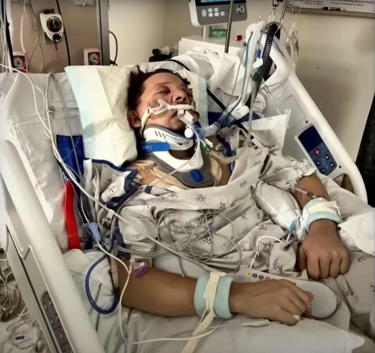 Screengrab of an ABC News teaser for Jeremy Renner's first TV interview since his traumatic snow plow accident on January 1, 2023. The photo shows Renner injured in a hospital bed.