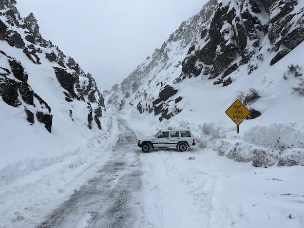 A police vehicle on a snowy road.