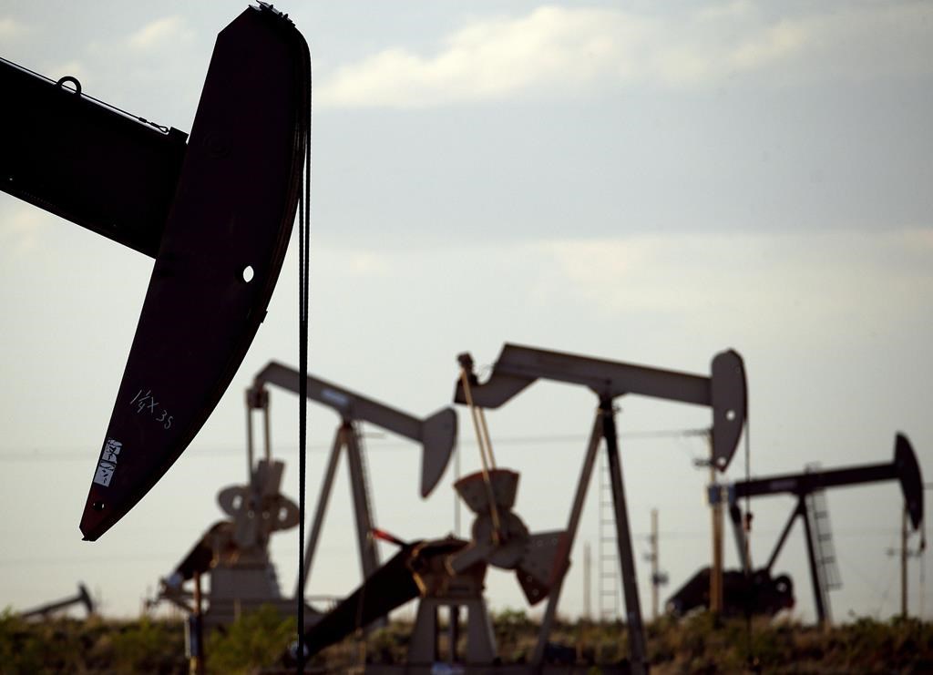 Pumpjacks work in a field near Lovington, N.M., on April 24, 2015.