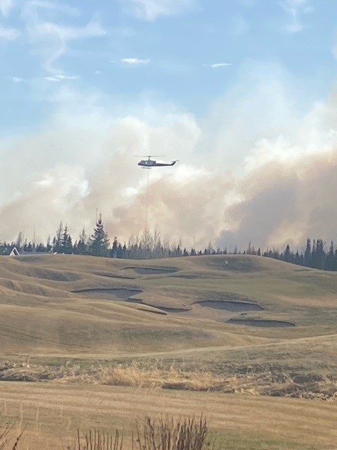 Emergency crews fighting a wildfire near Trestle Creek Golf Resort in Parkland County on Saturday, April 29, 2023.
