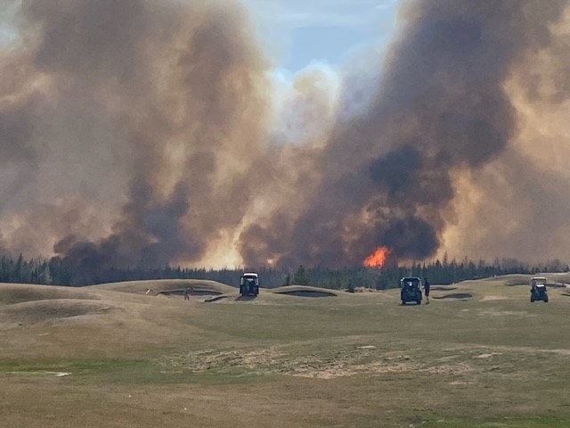 Emergency crews fighting a wildfire near Trestle Creek Golf Resort in Parkland County on Saturday, April 29, 2023.